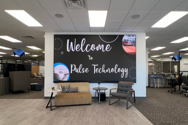 A large video wall at the entrance of the Pulse Technology Merrillville Indiana office.