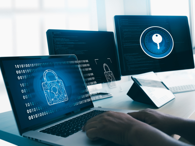 A person working on multiple devices that have digital padlocks and keys on them.