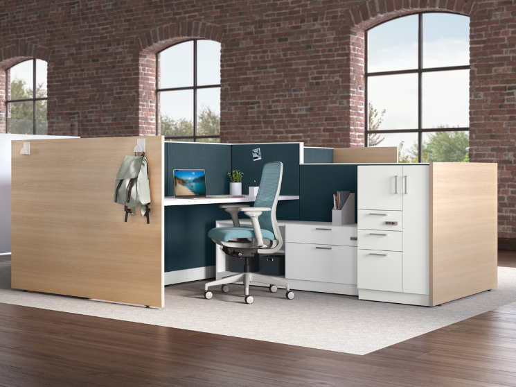 A modern, open cubicle in an office.