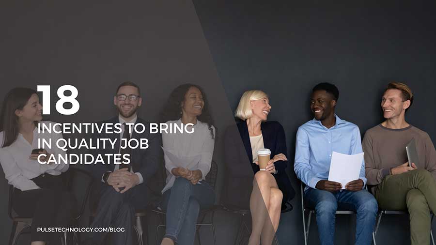 A row of job candidates sitting in chairs.