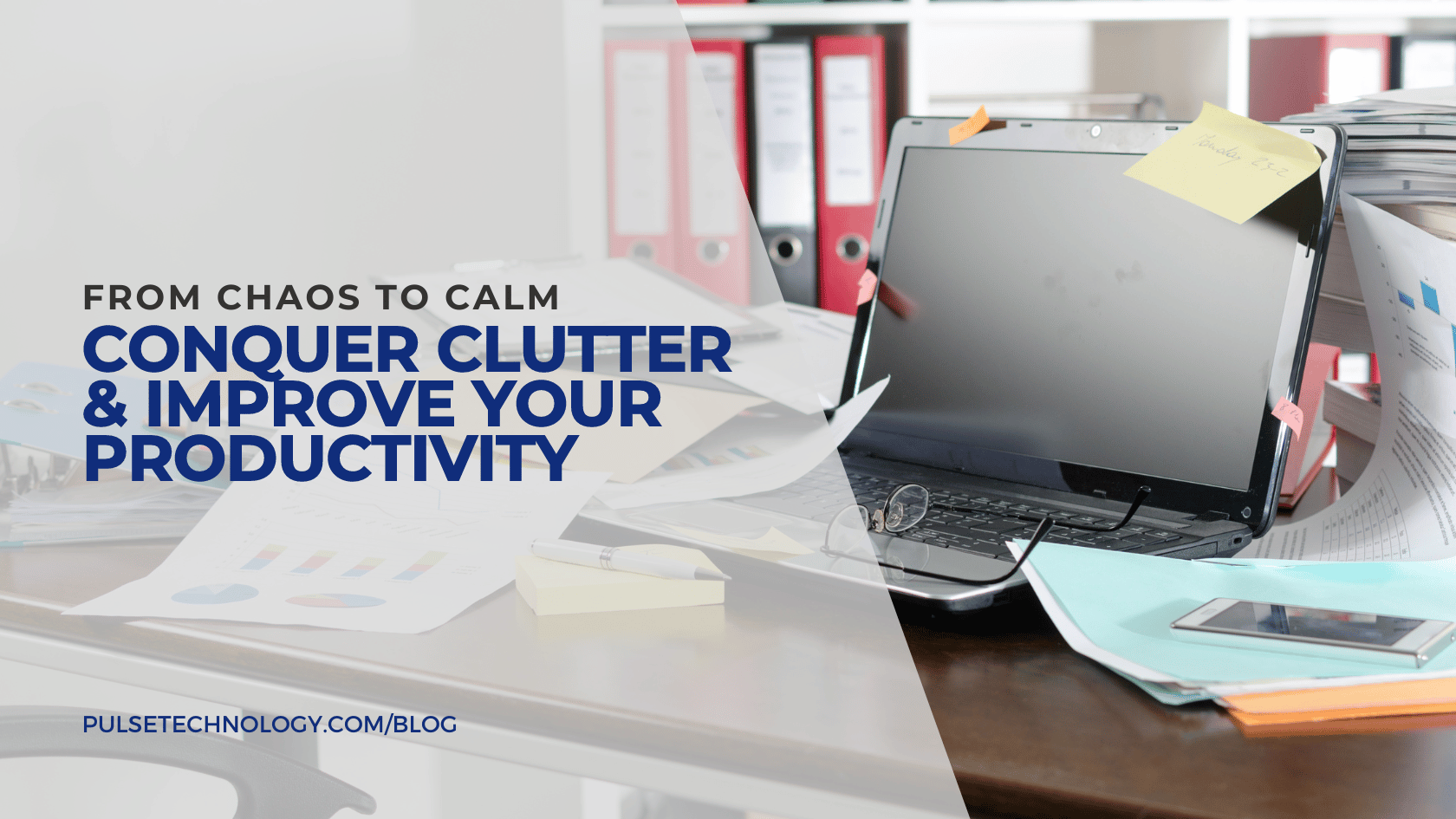 A cluttered desk with a laptop and post it notes.