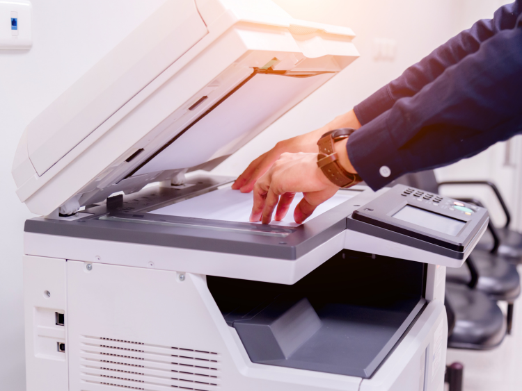 A person using a copier.