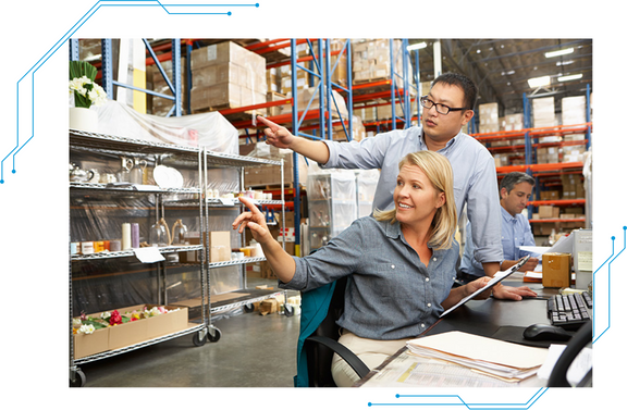 Two people in a warehouse.