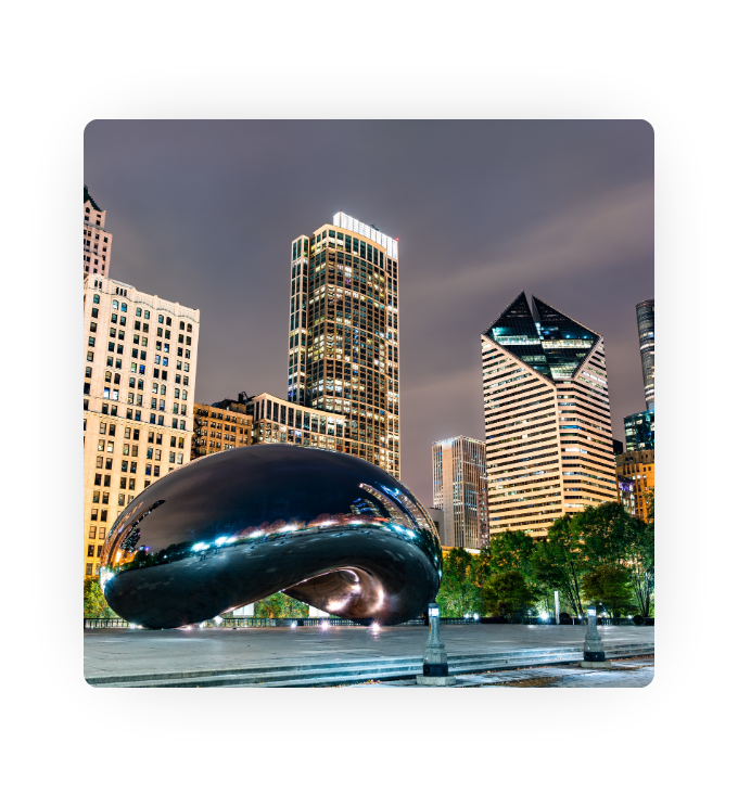 An evening photo of Chicago Illinois, specifically the famous Bean.