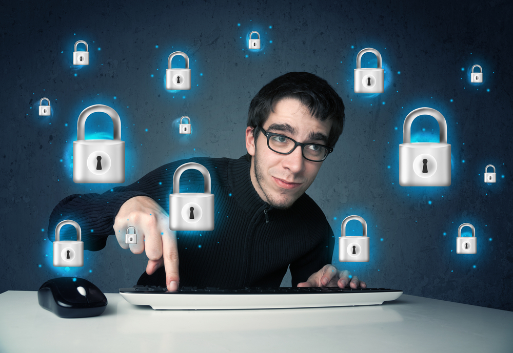 A person using their pointer finger to press a button on a keyboard. There are digital looking padlocks floating around that person.